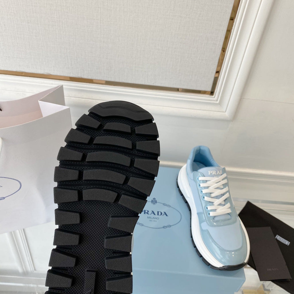 PRADA 25S THICK SOLE SNEAKER IN LIGHT BLUE CALFSKIN AND CANVAS