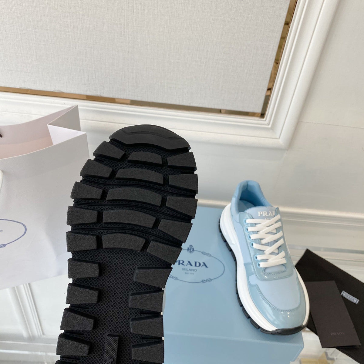 PRADA 25S THICK SOLE SNEAKER IN LIGHT BLUE CALFSKIN AND CANVAS