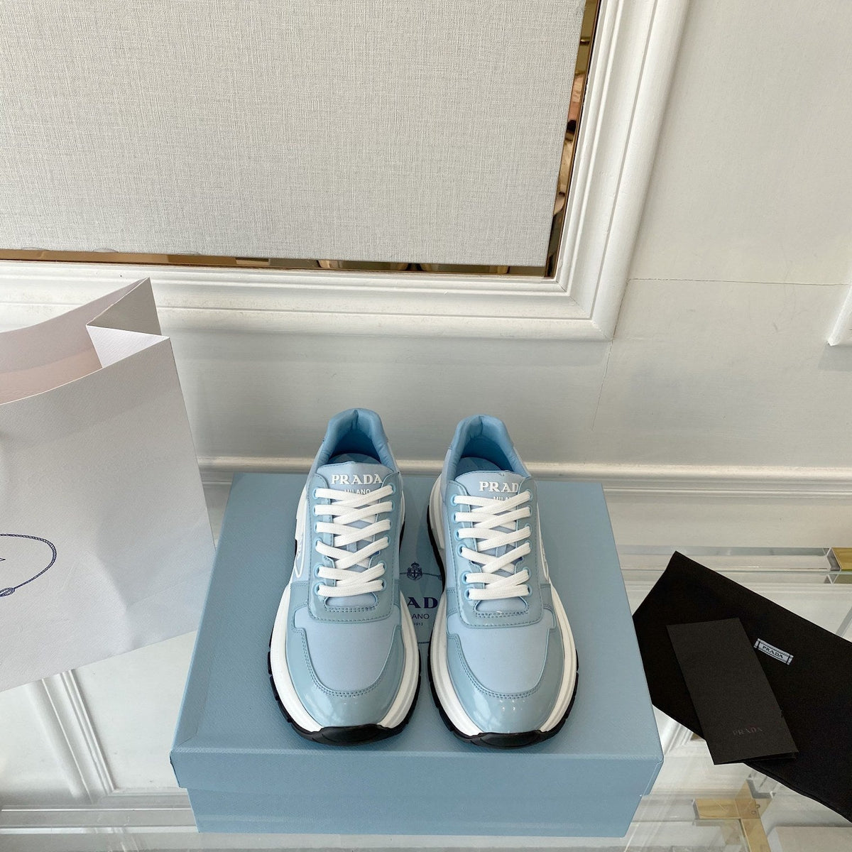 PRADA 25S THICK SOLE SNEAKER IN LIGHT BLUE CALFSKIN AND CANVAS