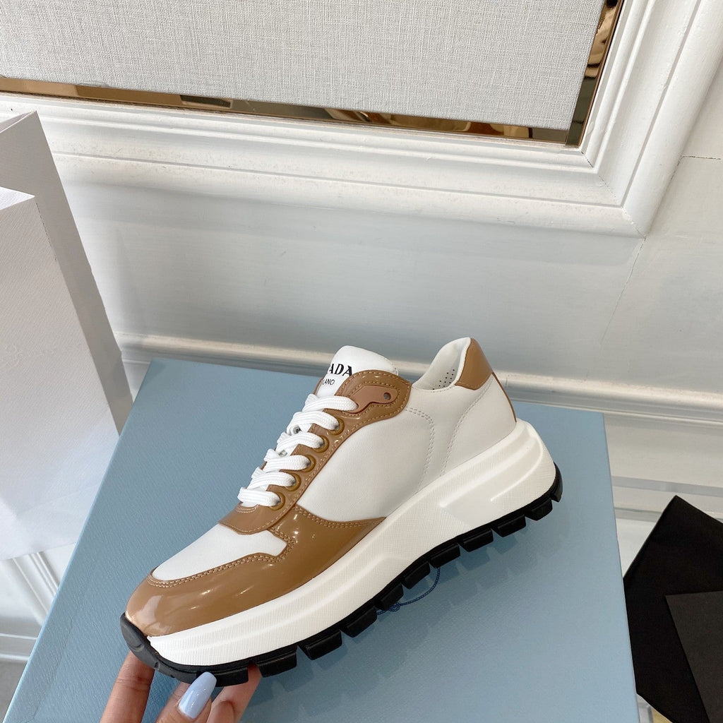 PRADA 25S THICK SOLE SNEAKER IN WHITE AND BROWN CALFSKIN