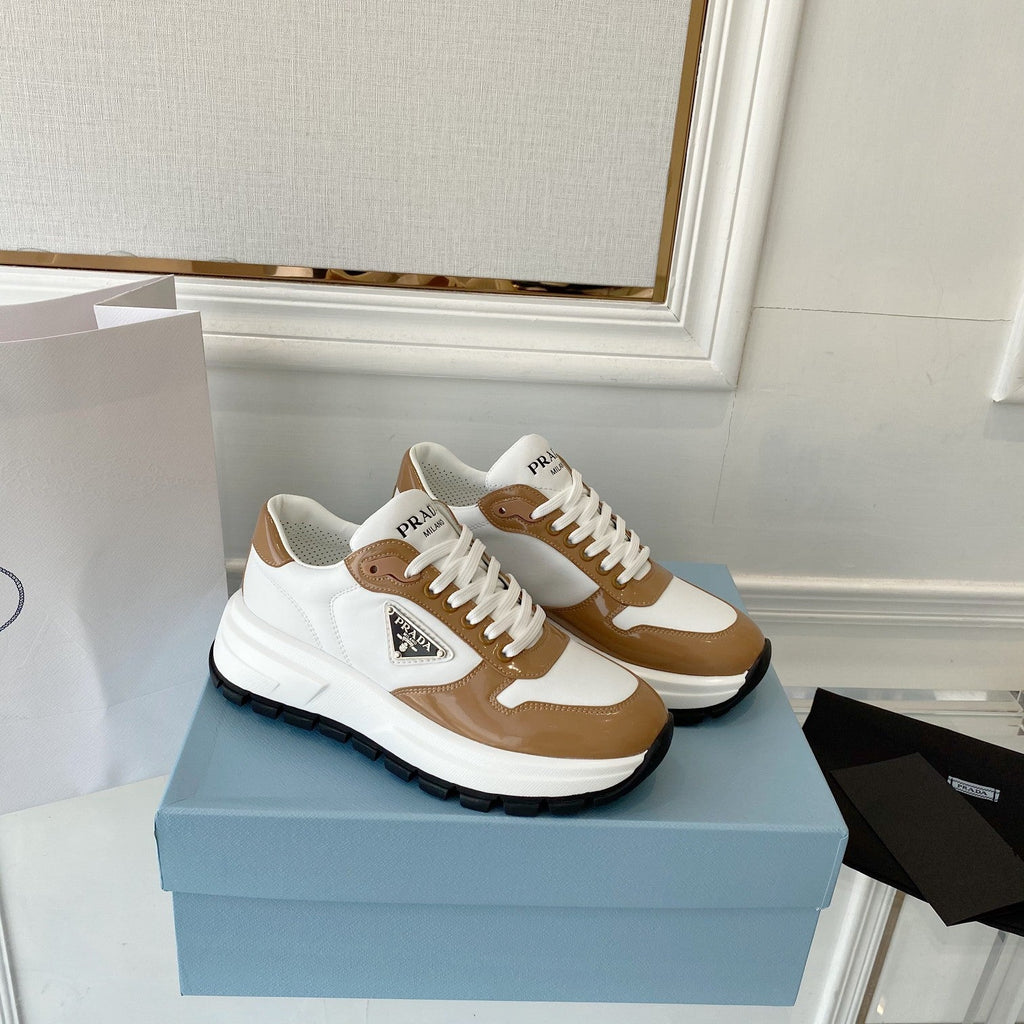 PRADA 25S THICK SOLE SNEAKER IN WHITE AND BROWN CALFSKIN