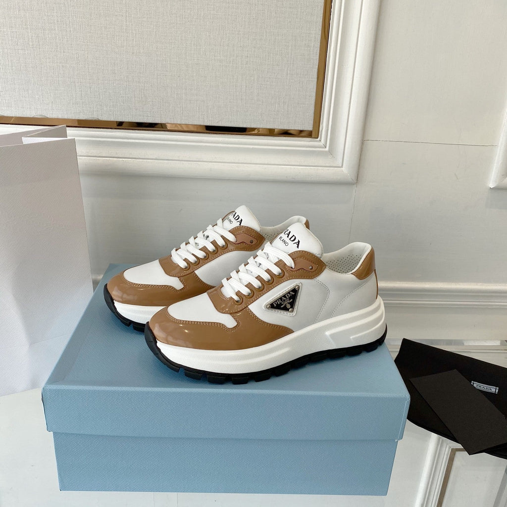 PRADA 25S THICK SOLE SNEAKER IN WHITE AND BROWN CALFSKIN