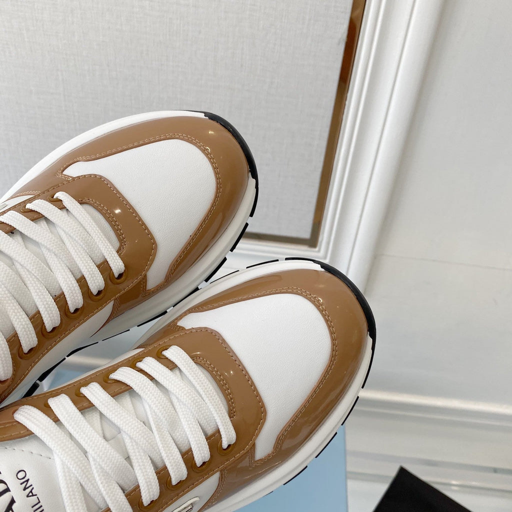 PRADA 25S THICK SOLE SNEAKER IN WHITE AND BROWN CALFSKIN