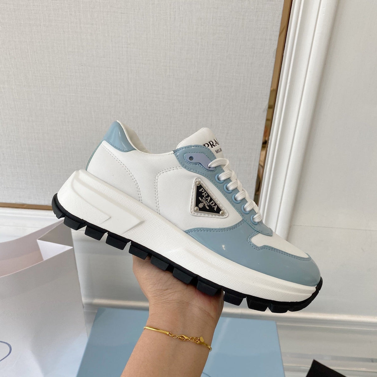 PRADA 25S THICK SOLE SNEAKER IN WHITE AND LIGHT BLUE CALFSKIN
