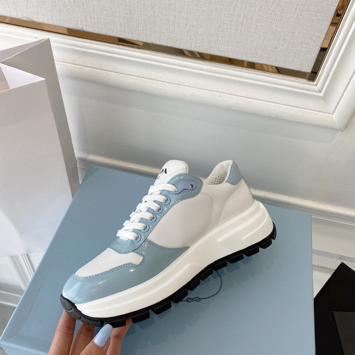PRADA 25S THICK SOLE SNEAKER IN WHITE AND LIGHT BLUE CALFSKIN