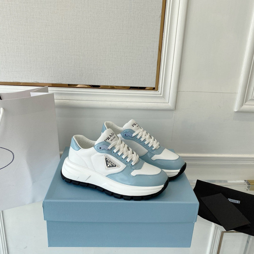 PRADA 25S THICK SOLE SNEAKER IN WHITE AND LIGHT BLUE CALFSKIN