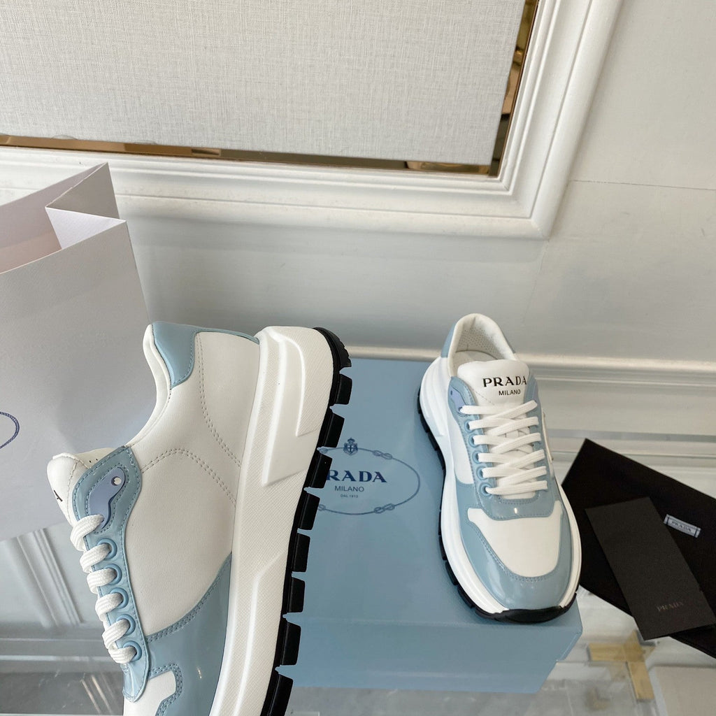 PRADA 25S THICK SOLE SNEAKER IN WHITE AND LIGHT BLUE CALFSKIN