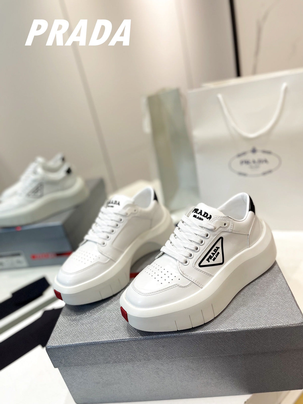 PRADA DOWNTOWN THICK-SOLE SNEAKERS WHITE CALFSKIN