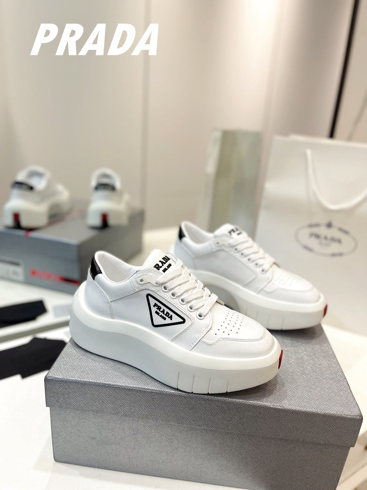 PRADA DOWNTOWN THICK-SOLE SNEAKERS WHITE CALFSKIN