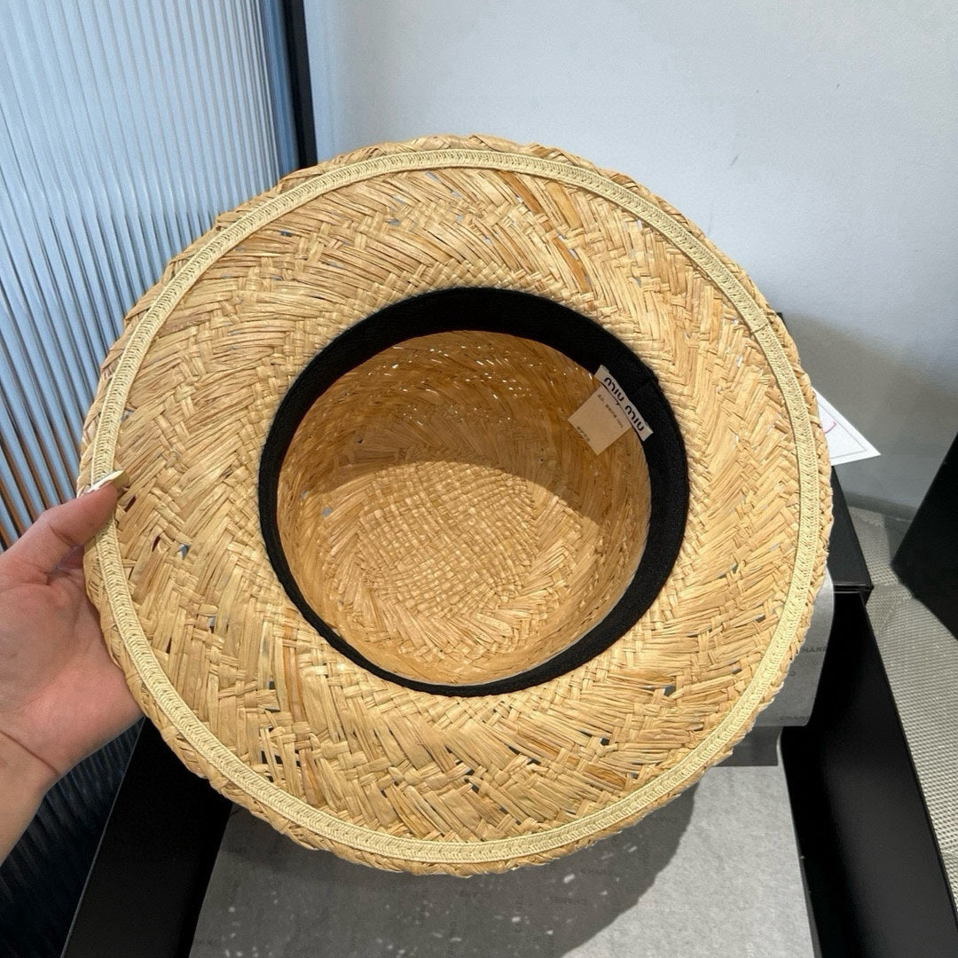 MM STRAW HAT IN BEIGE RAFFIA WITH BLACK FLOWER ACCENT
