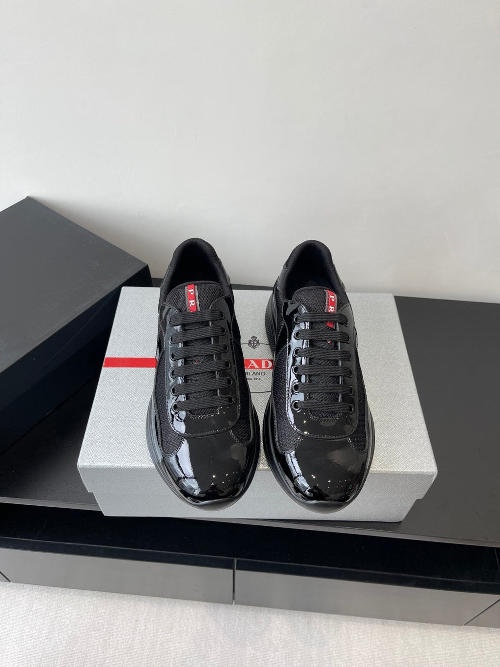 PRADA SNEAKER 25S IN BLACK MESH AND PATENT CALFSKIN