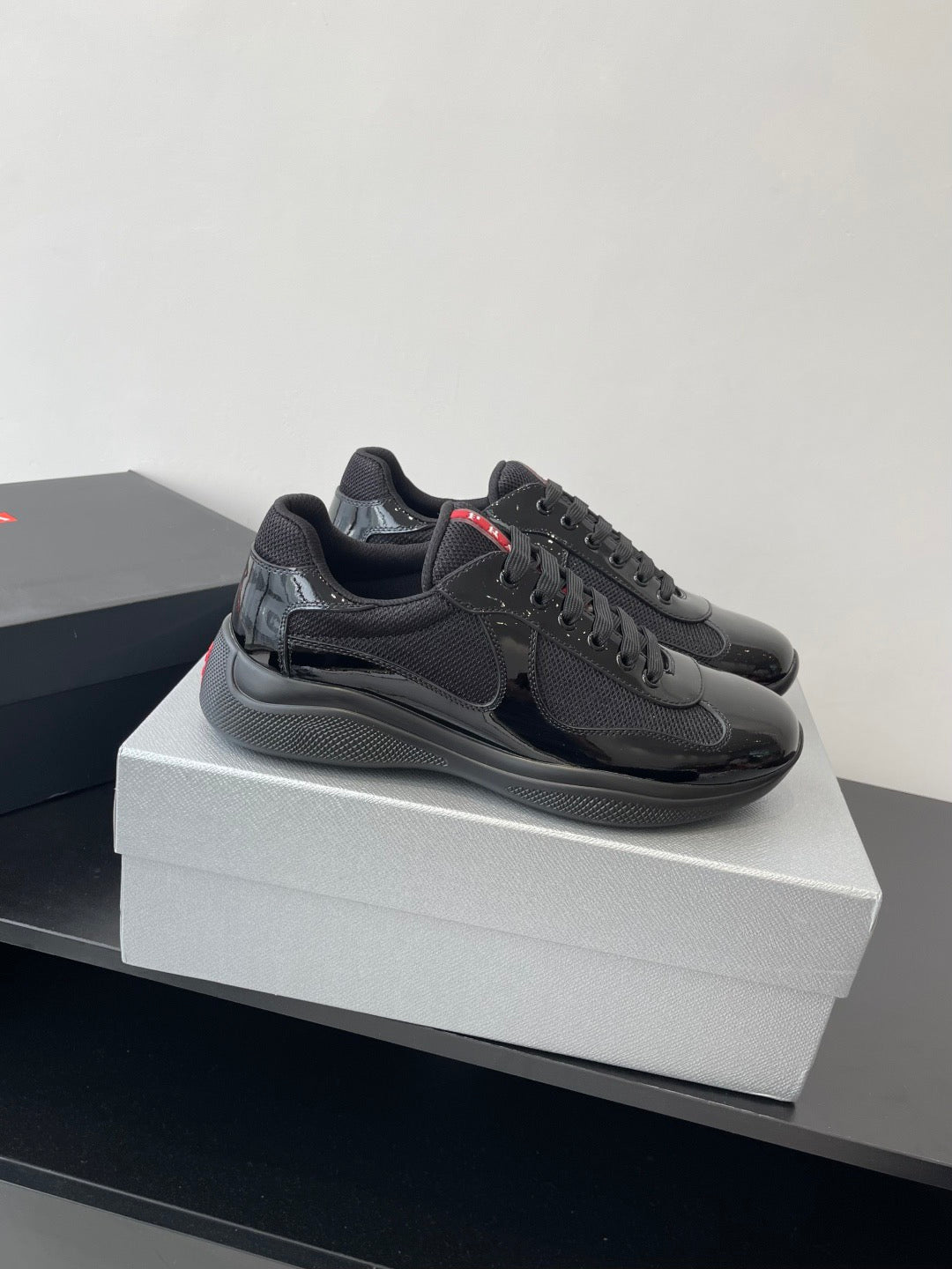 PRADA SNEAKER 25S IN BLACK MESH AND PATENT CALFSKIN
