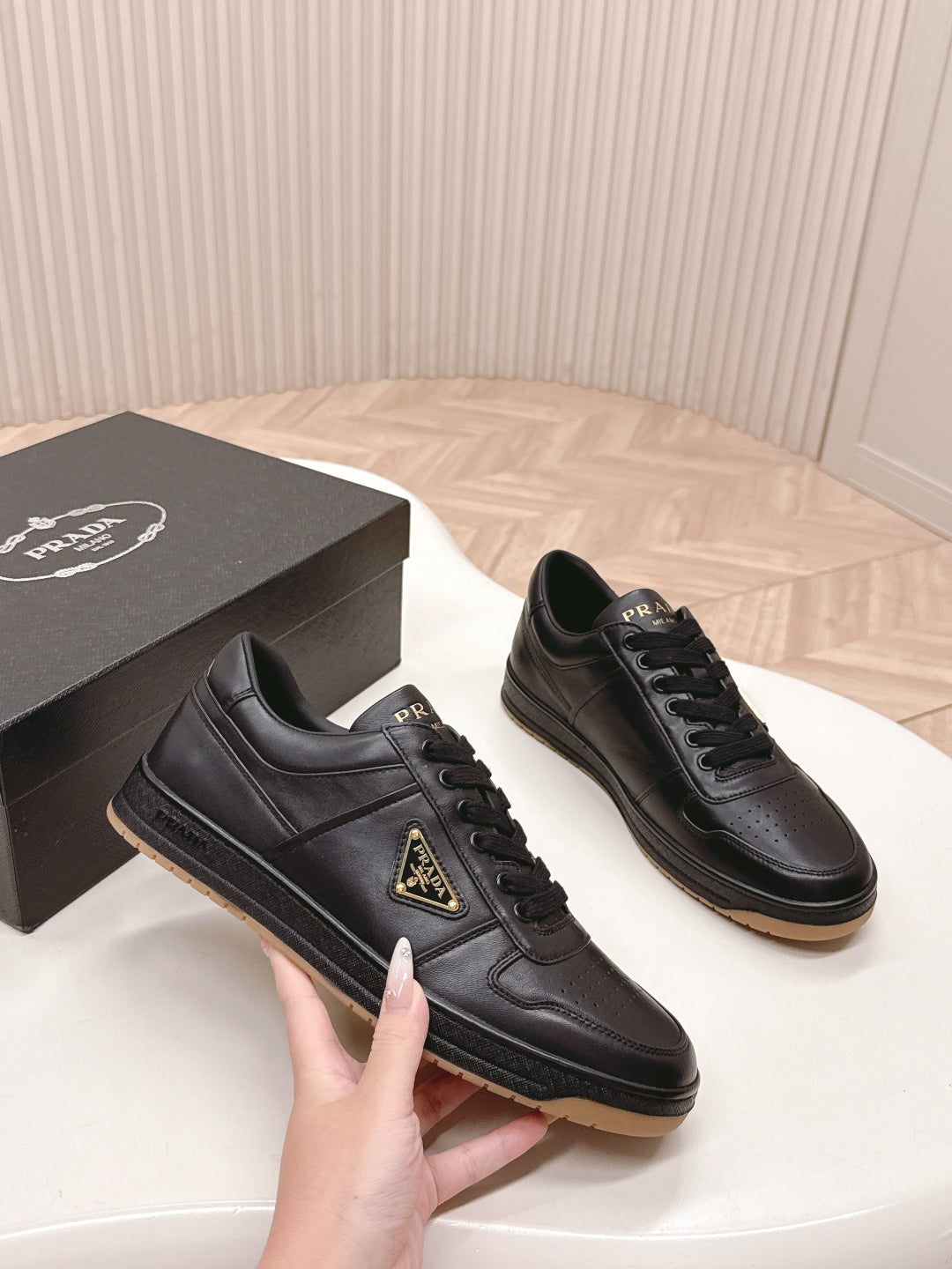PRADA 25S DOWNTOWN SNEAKERS IN BLACK CALFSKIN