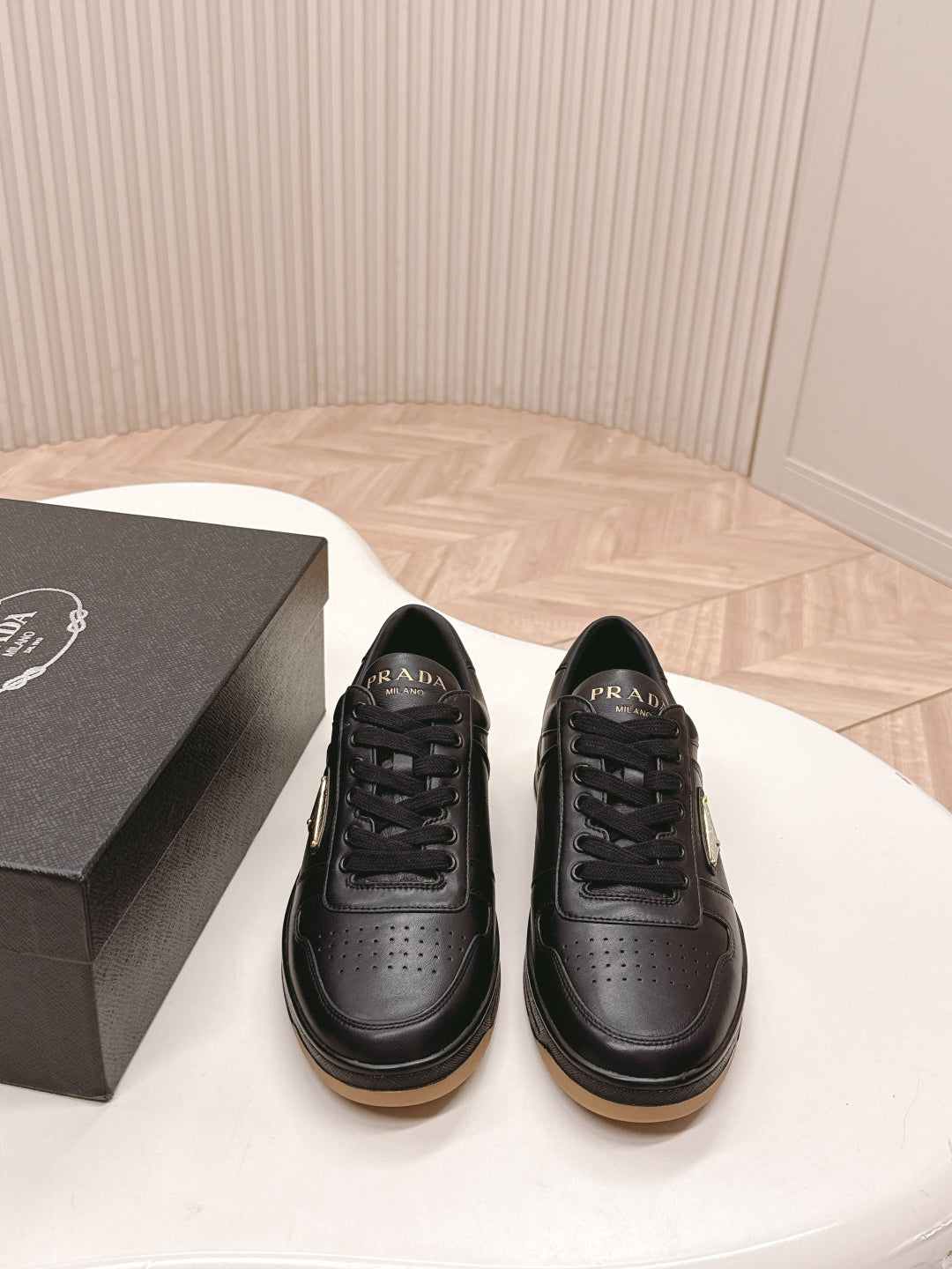PRADA 25S DOWNTOWN SNEAKERS IN BLACK CALFSKIN