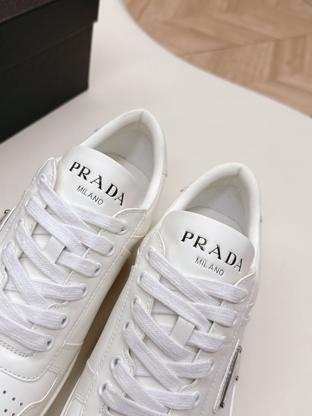 PRADA 25S DOWNTOWN SNEAKERS IN WHITE CALFSKIN SILVER HARDWARE