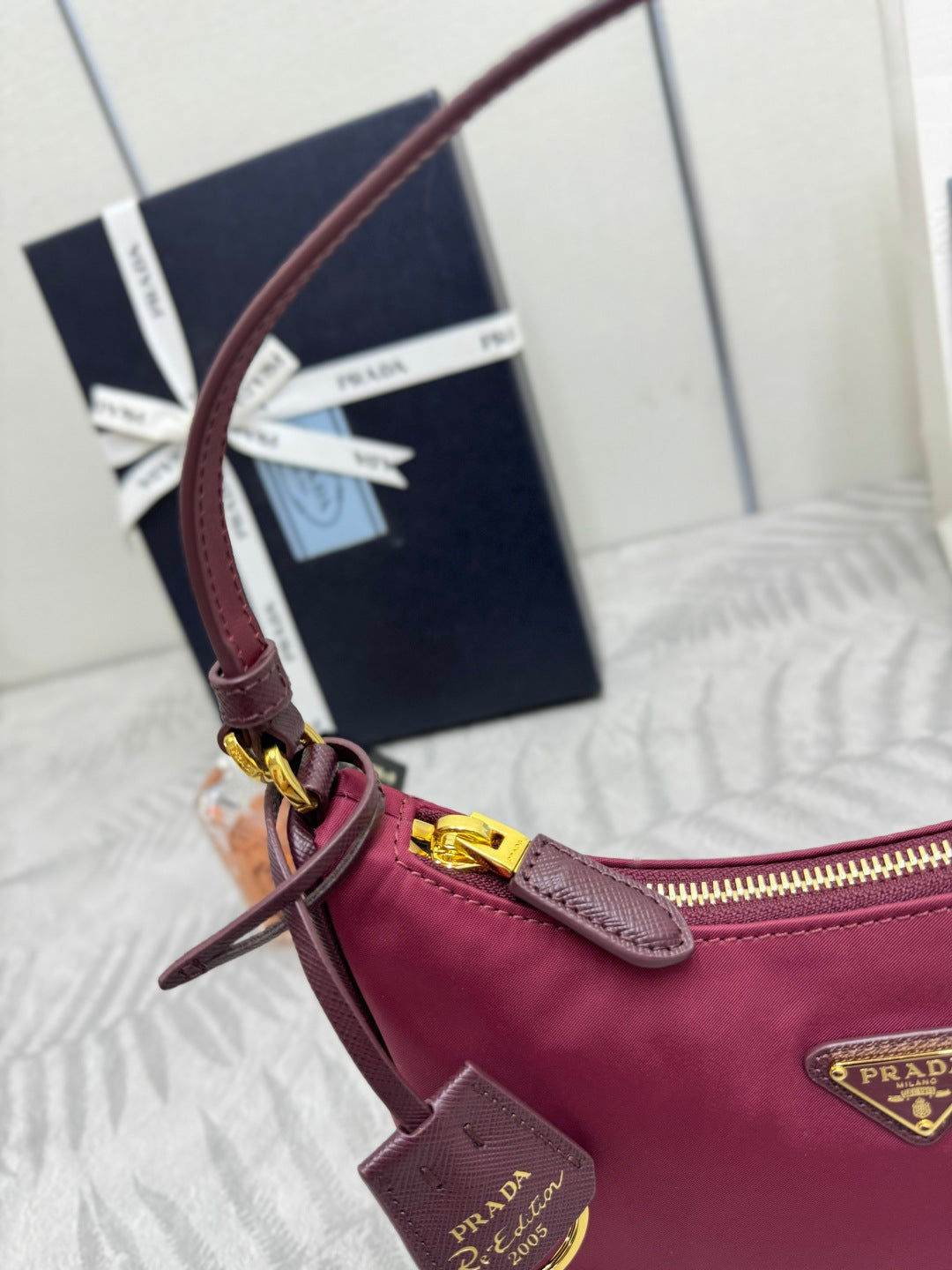 PRADA 25S RE-EDITION 2005 MINI BAG 22 IN BURGUNDY RE-NYLON AND SAFFIANO