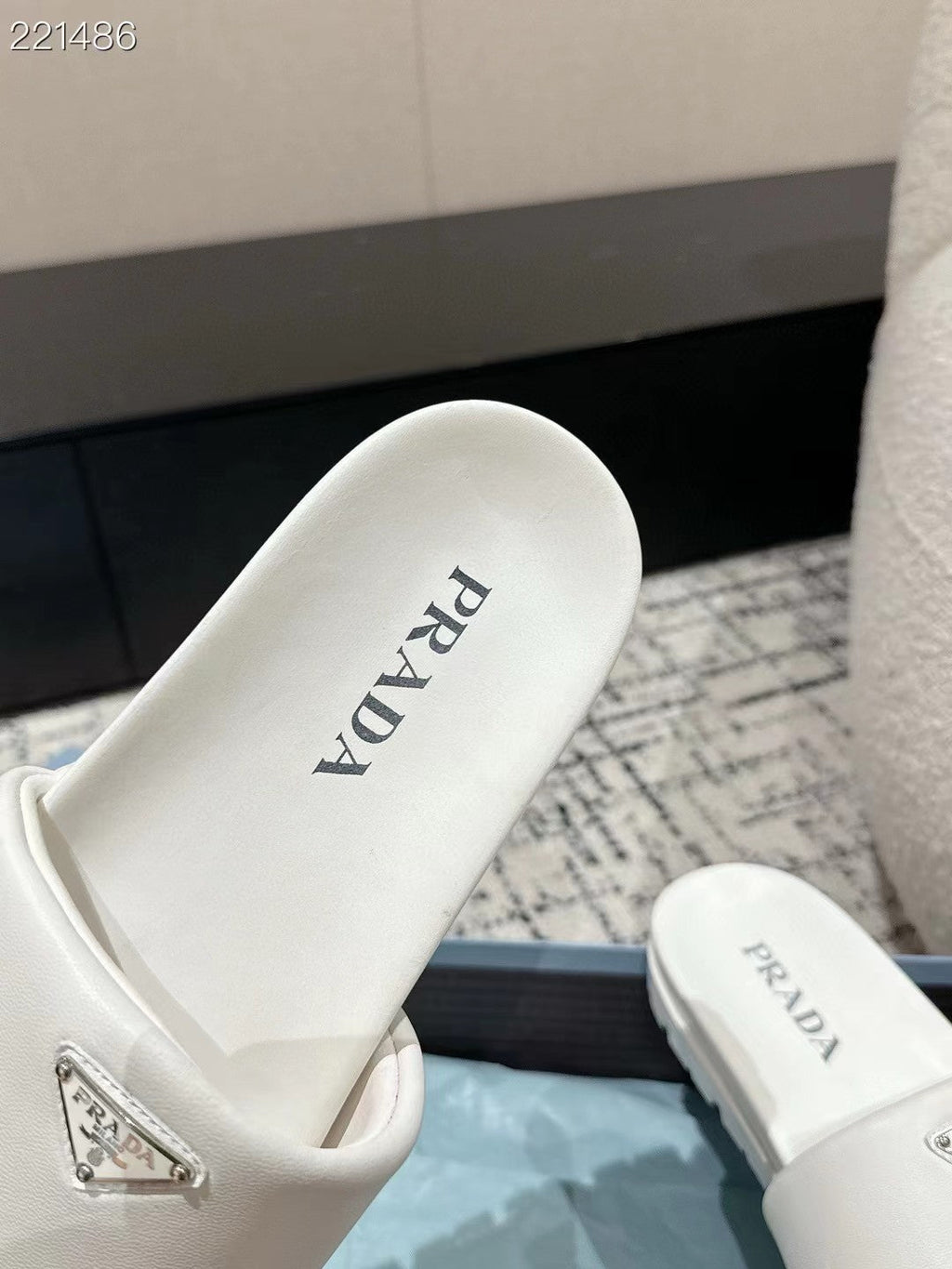 PRADA 25S PADDED SLIDES IN WHITE CALFSKIN WITH LOGO