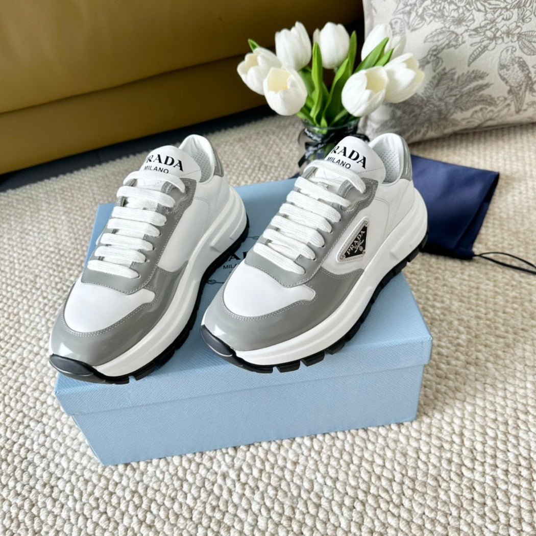 PRADA BLACK THICK SOLE SNEAKER GRAY AND WHITE CALFSKIN