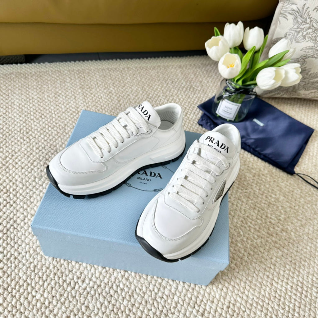 PRADA THICK SOLE SNEAKER WHITE AND BLACK LOGO CALFSKIN