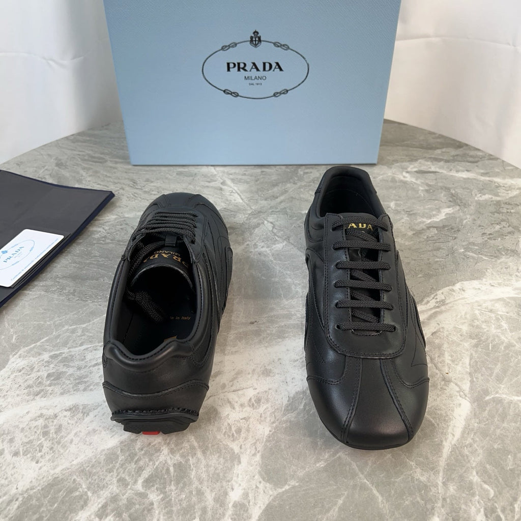 PRADA 25S MONTECARLO ANTIQUED SNEAKERS IN BLACK NAPPA LEATHER