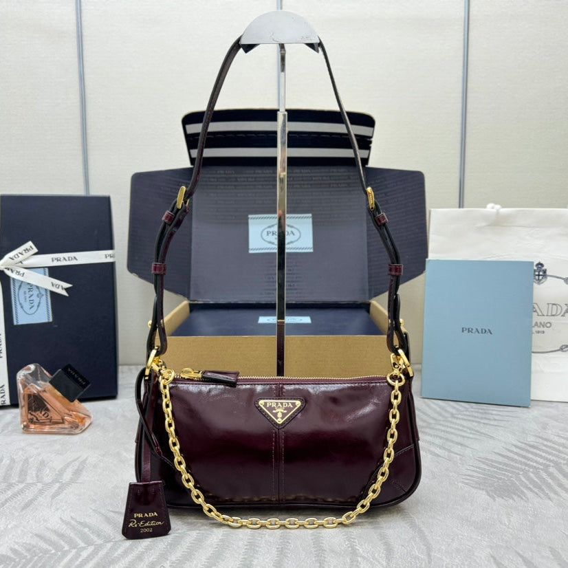 PRADA 25S RE-EDITION 2002 MEDIUM SHOULDER BAG 26 IN BURGUNDY CALFSKIN GOLD HARDWARE