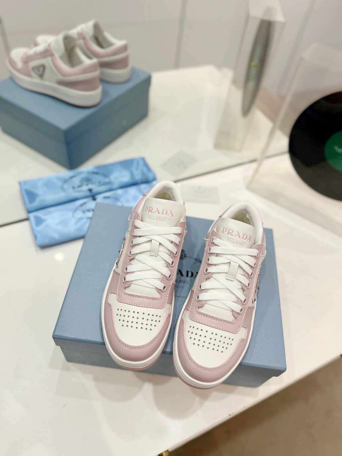 PRADA DOWNTOWN PERFORATED SNEAKERS WHITE AND BLUSH CALFSKIN