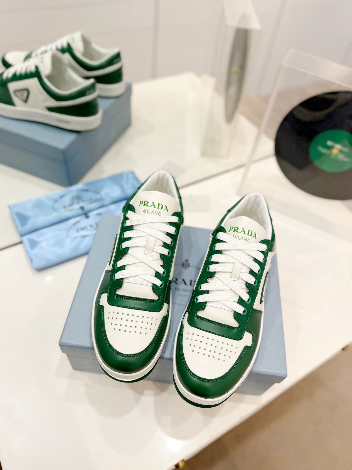 PRADA DOWNTOWN PERFORATED SNEAKERS WHITE AND GREEN CALFSKIN